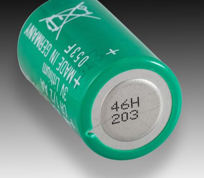 CIJ product marking: two-line alpha-numeric code in black ink on metal battery end