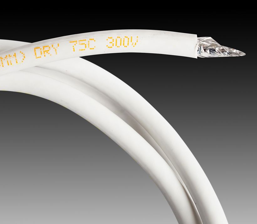 CIJ product marking: single line alpha-numeric code in yellow ink on a white vinyl cable jacket
